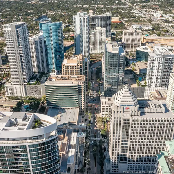 Skyline of downtown Fort Lauderdale with high-rise buildings, showcasing a bustling city area served by Miami Premier Transportation