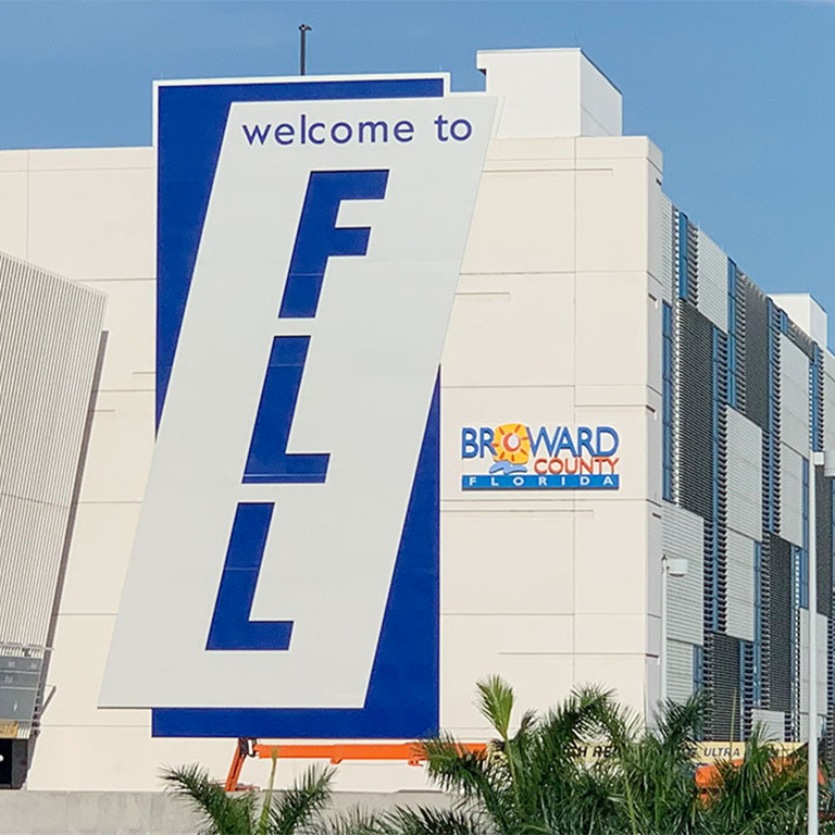 Front view of Hollywood-Fort Lauderdale International Airport sign, representing luxury airport transfer services by Miami Premier Transportation