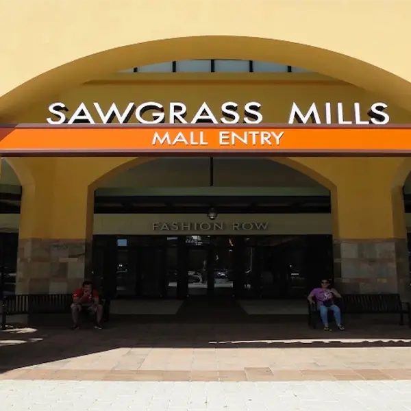 Main entrance of Sawgrass Mills Mall in Sunrise, FL, showcasing a popular shopping destination served by Miami Premier Transportation