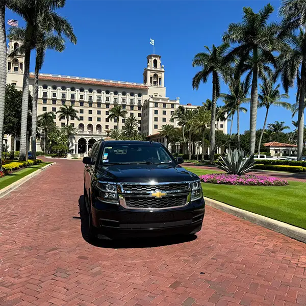 Black SUV parked in front of The Breakers resort in West Palm Beach, showcasing Miami Premier Transportation's luxury services at high-end destinations